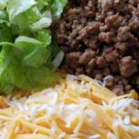 Beef Taco Bowl · Seasoned ground beef with shredded cheddar cheese, romaine lettuce, tomatoes, and on the sid...