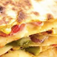 Roasted Vegetable Quesadilla · Marinated Roasted zucchini, yellow squash, red onion, peppers smothered in cheddar cheese ho...