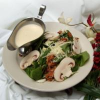 Dinner Spinach Salad · Contains raw eggs. Served with bacon, chopped eggs, mushrooms and fresh Romano cheese tossed...