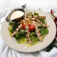 Chicken Caesar Salad · Contains raw egg. Crisp romaine lettuce tossed with croutons, Parmesan cheese and Caesar dre...