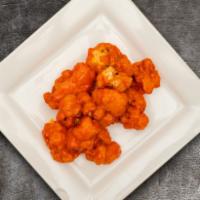 Dynamo Buffalo Cauliflower  · Authentic sweet and spicy Buffalo sauce smothered cauliflower served with a blue cheese sauce.