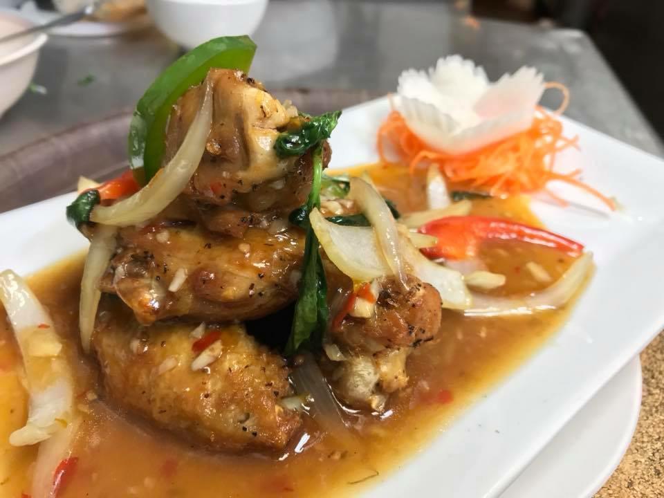 Thai Chicken Wings · Crispy chicken wings topped with House Basil Sauce.