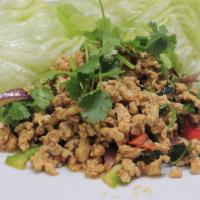 Larb Gai · Minced chicken, chili powder, roasted rice powder, onion, and cilantro with Thai chili-lime ...
