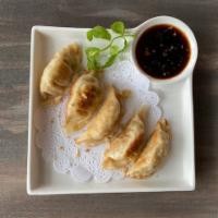 Arigato · Pan-fried pork and vegetable pot stickers. Served with soy garlic vinaigrette.