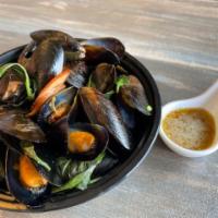 Steamed Mussels  · Steamed green mussels with lemongrass and Thai basil. Served with a spicy lime sauce.