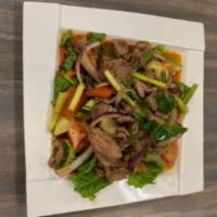 Yum Neu Salad · Thai style beef salad with cucumber, tomato, red onion, green onion, and cilantro mixed with...