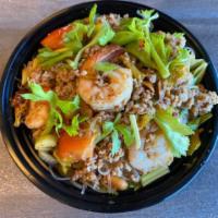 Yum Woon Sen Salad · Clear noodles, ground pork, prawns, tomato, celery, red onion, cilantro and peanuts in a roa...