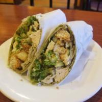 Chicken Caesar Wrap · Rotisserie chicken wrapped in a soft tortilla, topped with red onions, romaine lettuce and c...