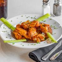 Chicken Wings · 10 pieces classic chicken wings tossed in any one of our 3 sauces,  jalapeno whiskey, BBQ or...