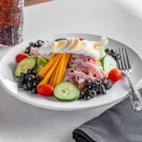 Classic Chef Salad · Country ham, house-roasted turkey, cheddar and Swiss cheeses served on a bed of crisp lettuc...