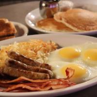 Jubitz Triple Play · 3 pieces of bacon, 3 sausage links, 3  eggs served any style, 3 buttermilk pancakes, hash br...