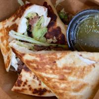 Quesadilla · Corn masa warmed and folded. Filled with Oaxaca cheese and stuffed with choice of protein.
