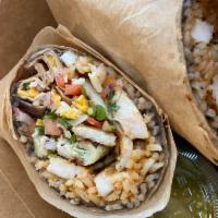 The Burrito · A warm rolled flour tortilla stuffed with rice, beans cheese pico de gallo and choice of chi...