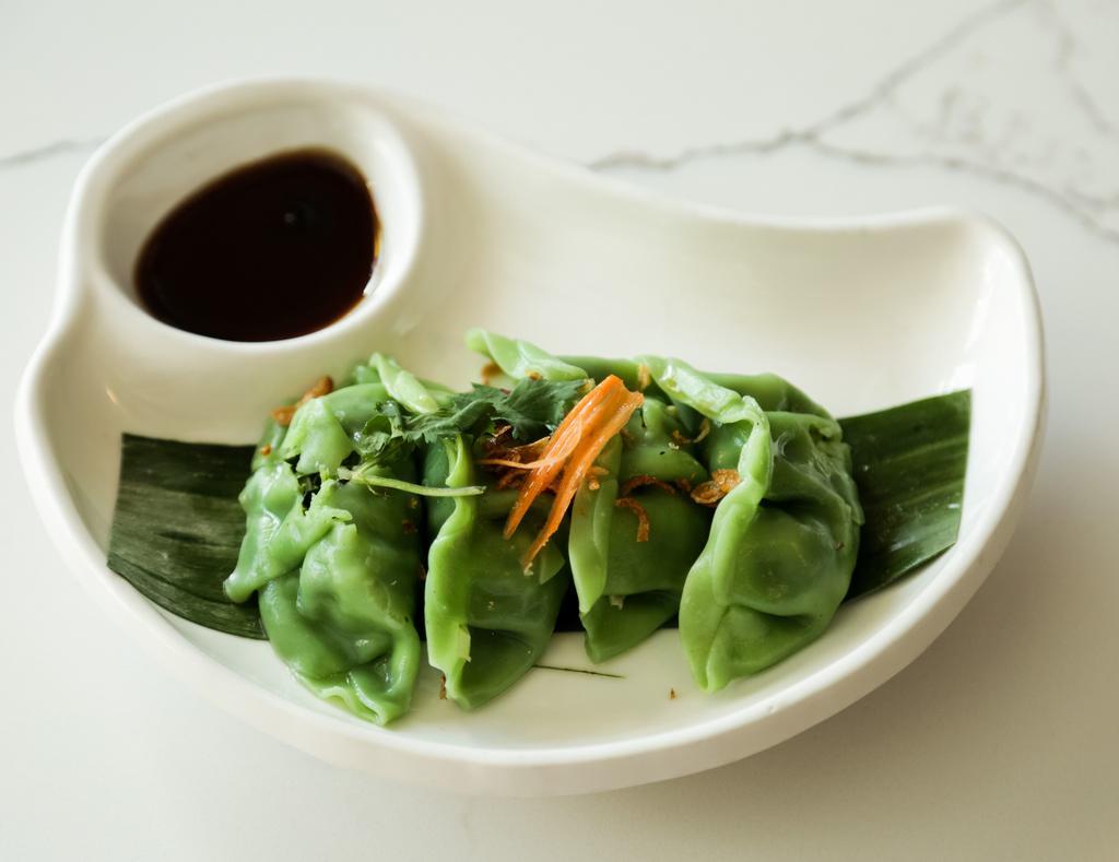 Vegetable Dumpling · Mixed vegetables wrapped in wonton skin, served with housemade mushroom soy dipping sauce.