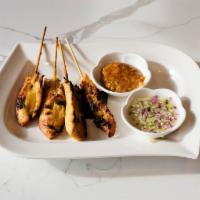 Chicken Satay · Marinated chicken on skewer served with peanut sauce and cucumber vinaigrette.