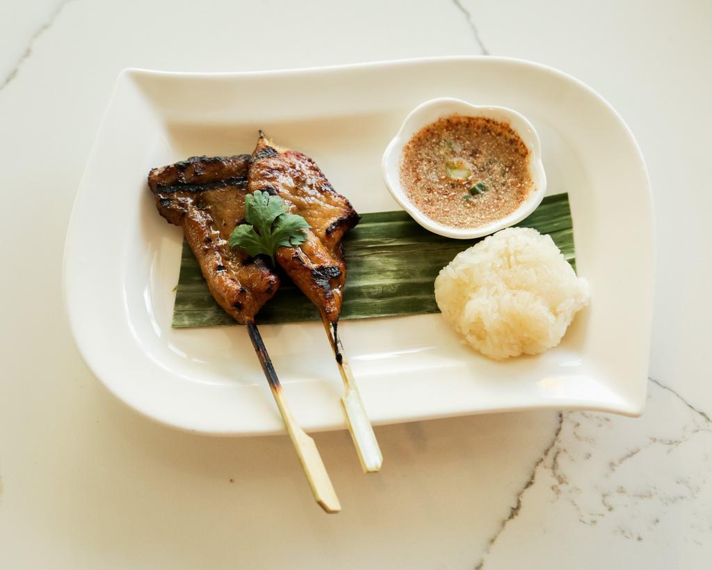 Grilled Pork Skewer · Thai style pork marinated and grilled to perfection.