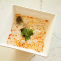 Tom Kha Kai Soup · Creamy coconut milk, lemongrass, and galangal broth with mushroom and chicken.