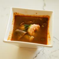 Tom Yum Koong Soup · Light and spicy sour lemongrass broth simmered with galangal, lemongrass and onion with mush...