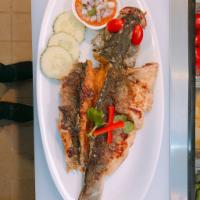 Crispy Fried Red Snapper · Crispy Red Snapper with basil sauce served with white rice.