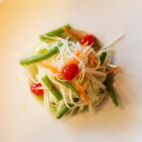 Papaya Salad · Shredded green papaya, tomato, string bean and peanut tossed in an exotic Thai spicy lime dr...