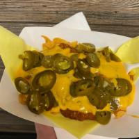 Nachos with Cheese and Jalapenos · Corn chips topped off with warm melted nacho cheese and jalapenos.