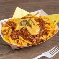 Frito Pie · Fritos covered with hot chile con carne, hot melted cheese and jalapeños
