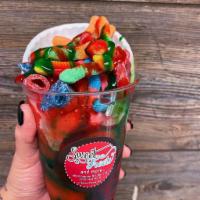 Sour Patch Extreme · Italian Ice Drizzle in red and green chamoy from the bottom to the top, with sour patch kids...