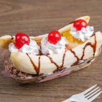 Banana Split · Strawberry, Chocolate, and vanilla ice cream, topped off with pineapple and strawberry jelly...