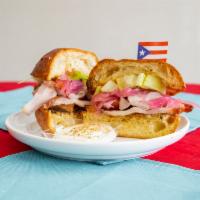 Pernil Sandwich  · Served with house red onions, garlic aioli and house made plantain chips. 