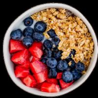 Yogurt Parfait · Creamy vanilla yogurt with fresh strawberries and blueberries served with crunchy granola an...