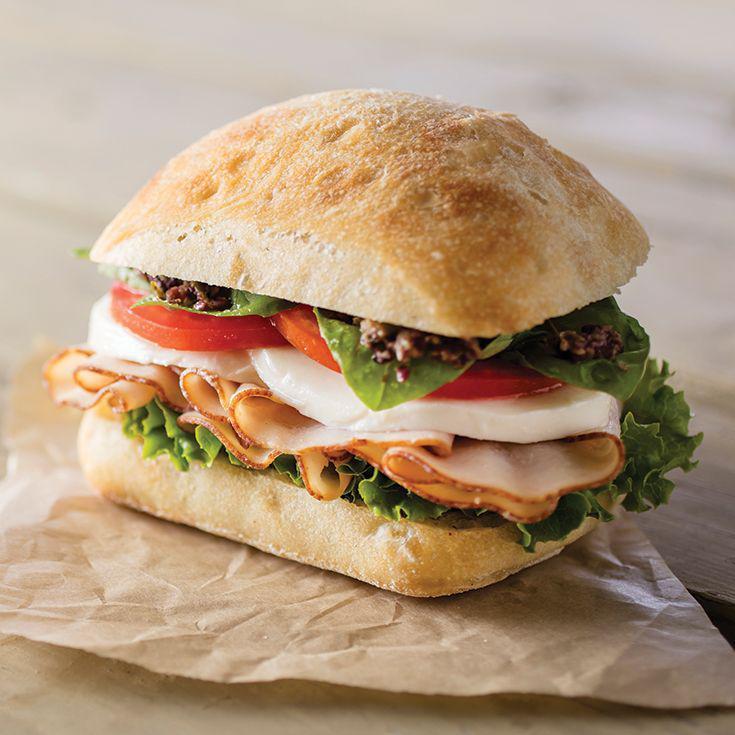 Smoked Turkey and Mozzarella Sandwich · Mozzarella is the ultimate  cheese. Here we've combined it with smoked turkey and fresh basil to make a satisfying lunch just for you !(Smoked turkey, fresh mozzarella, arugula, tomato and balsamic vinaigrette)