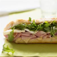 Heavenly Ham and Brie Baguettes · The humble ham-and-cheese sandwich gets an upgrade with black forest ham, Brie, arugula...Yo...