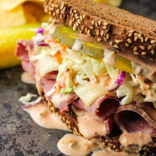 The Real New Yorker · This is  a really tasty roast beef and roast turkey mixed sandwich, especially when they are made with our homemade Russian dressing! Just one bite and your luck will change for the better! Roast beef, roast turkey, melted Swiss cheese, coleslaw and Russian dressing.