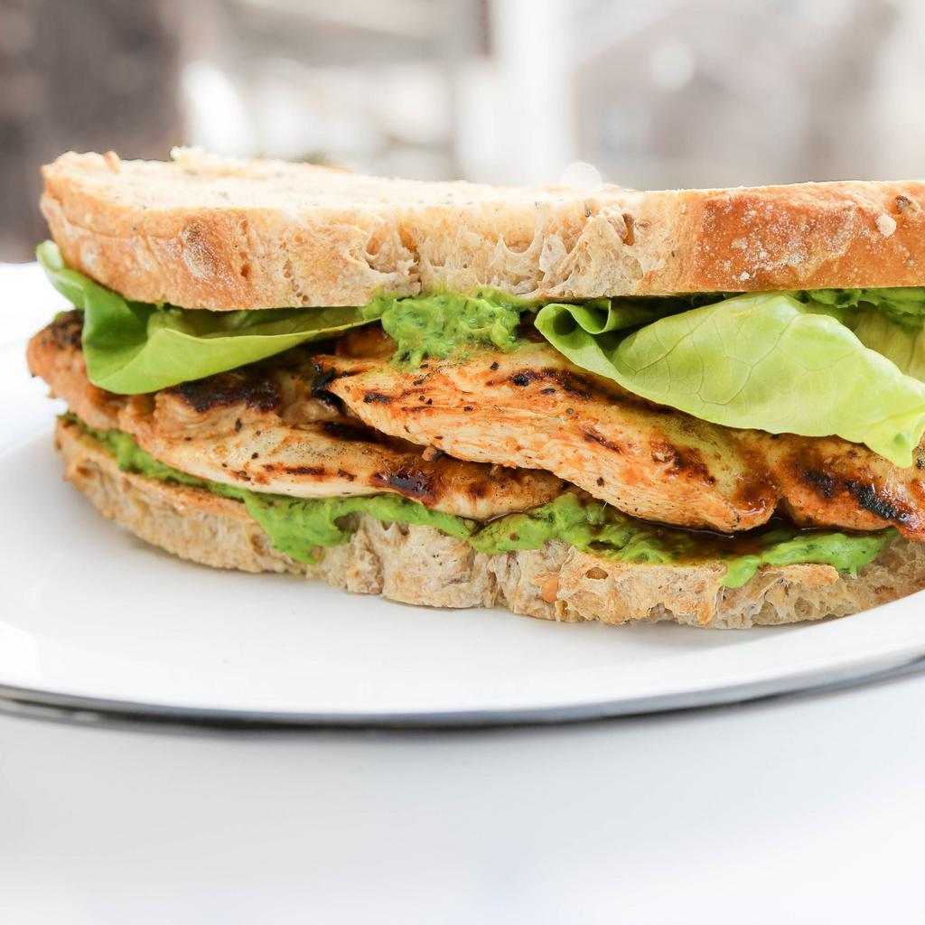 Grilled Chicken Sandwich with Avocado and Herbs · You definitely won't be hungry later. Grilled boneless chicken breast, stacked with cucumbers, tomatoes watercress and avocado served with yogurt dill sauce on a roll or Bread of your choice...