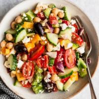 Yummy Colorful  chickpeas Salad  · It's a delicious concoction of Romaine lettuce, yellow peppers, shredded carrots, chickpeas,...