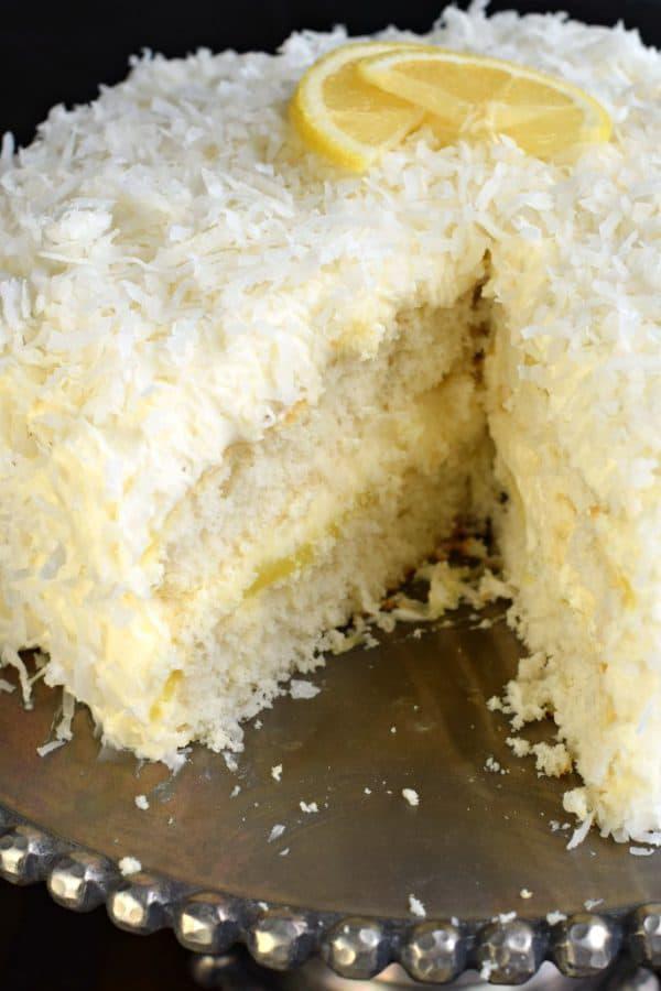 Fresh Coconut Lemon Cake Slice with Whip Cream · Sour yet super delicious.Moist, flavorful homemade Lemon Coconut Cake! A homemade loaf cake bursting with lemon and coconut flavor that’s topped with a lemon cream cheese frosting and shredded coconut