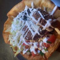 Tostada Salad · Tostada bowl, lettuce, cabbage, black beans, pico, Cotija and choice of ranch, lime vinaigre...