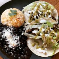 A Pair of Taco · Corn tortillas, served with beans and rice.