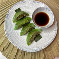 Jerk Veggie Dumplings · Cabbage, carrots, pidgeon peas, ginger vinegar.