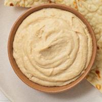Hummus · Served with toasted pita bread. celery, and carrot sticks.