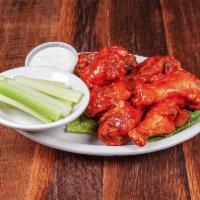 Spectators Famous Wings · Fried and tossed in our famous sauce, served with blue cheese and celery sticks.