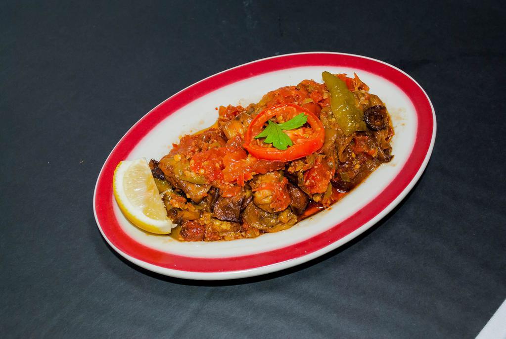 Eggplant with Spicy Tomato Sauce · Cubes of pan-fried eggplant sauteed with tomatoes, peppers and garlic.