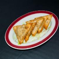 Spinach Pie · Thin-layered dough filled with a blend of fresh spinach, feta cheese and parsley. 5 triangles.