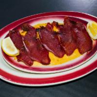 Hummus with Pastrami · Hummus topped with pastrami broiled and dressed with melted butter.