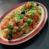 Shepherd Salad · Chunks of tomatoes, cucumbers, onions and green peppers dressed with olive oil and vinegar t...