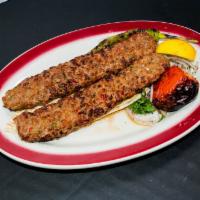 Beyti Kebab · Chopped lamb flavored with garlic, hot pepper and parsley, grilled on skewers and served wit...