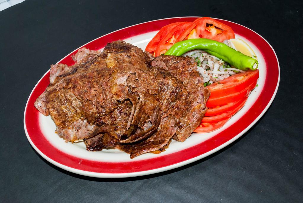 Doner Kebab · Ground lamb is wrapped around a large vertical spit and grilled in front of an ingenious tier of charcoal fires.
