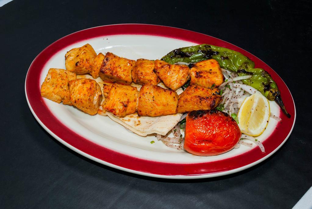 Chicken Kebab · Tender chunks of chicken marinated in the chef's special sauce with roasted peppers and tomatoes served with rice or french fries.