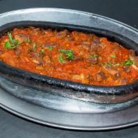 Lamb Sautee · Small pieces of baby lamb sauteed with tomatoes, onions and green peppers, seasoned with the...