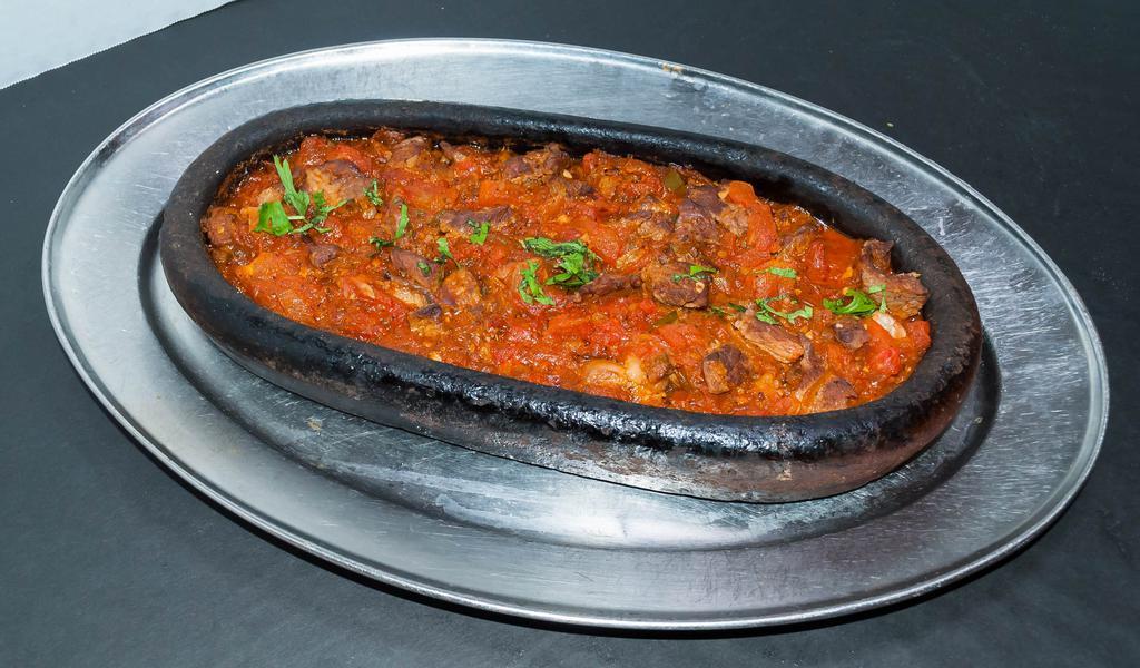 Lamb Sautee · Small pieces of baby lamb sauteed with tomatoes, onions and green peppers, seasoned with the chef's blend of herbs and spices served steaming in a casserole.